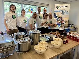Crane Worldwide Logistics Amsterdam team cooking food for the homeless